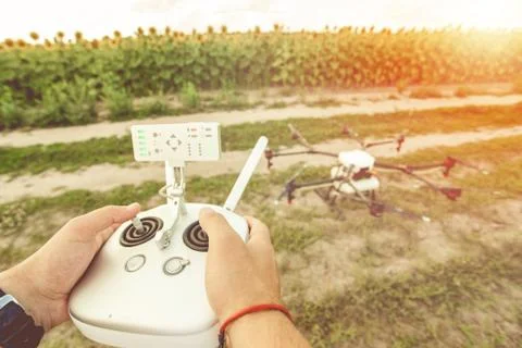 Remote control in the hands of the person. Stock Photos