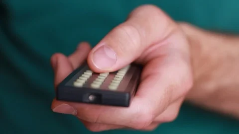 Remote control in man's hand close up Stock Footage 87971711