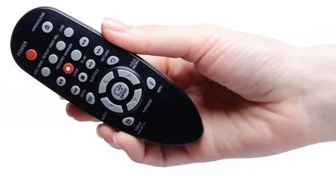 Remote Control media in hand Stock Photos