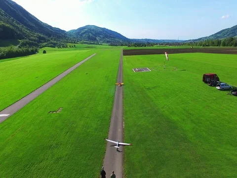 Remote control model plane flying, aerial view, RC Stock Footage 77996008