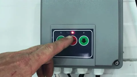 Remote control of opening roller shutters. A man presses the button. close-up Video stock 157837658