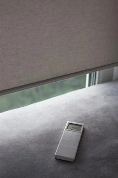 Remote control panel for motorized roller shades. Stock Photos