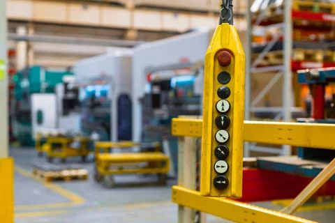 Remote control pendant switch for overhead crane in the factory Stock Photos