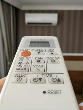 Remote control pointing at air conditioner Foto stock