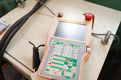 Remote control for robotic arm machine to work in the factory. Stock Photos