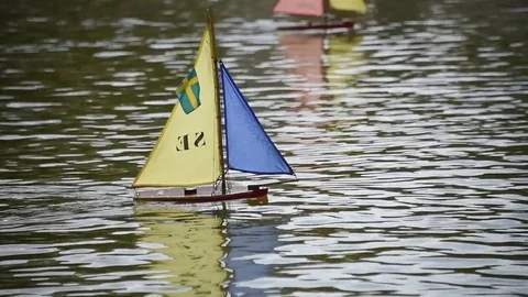 Remote control sailboat on pond in Paris France Stock Footage 73270122