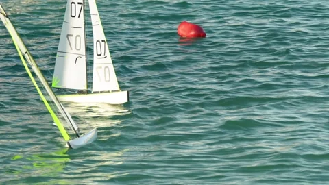 Remote control sailing boats in action during competition on clear blue lak.. Stock Footage 336692072
