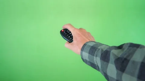 Remote control for satellite receiver box tv. Finger push bottom. Isolate green. Video stock 83769323