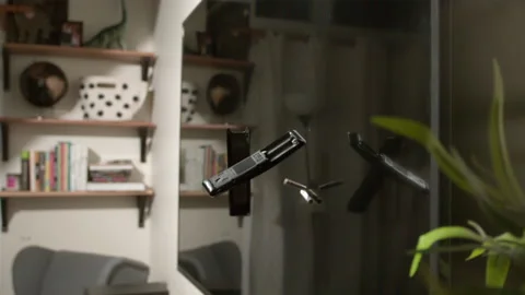 Remote control smashes on tv slow motion Stockbeeldmateriaal 161904547