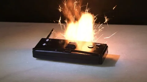 Remote control sparks due to short circuit creating damage and fire threat Stock Footage 332170150