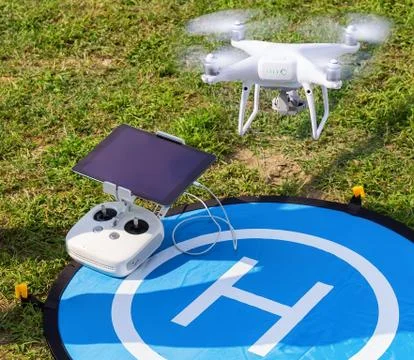 Remote control with tablet and take-off drone Stock Photos