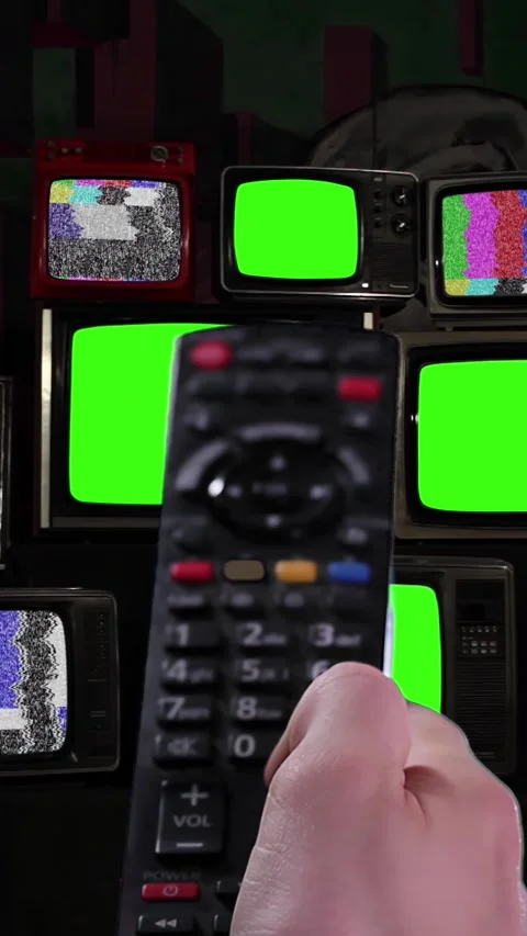 Remote Control Turning On and Off Old TV Stack with Green Screens - Vertical 4K Stock Footage 304096443