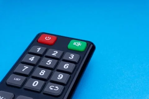 Remote control TV or radio isolated on blue background Фото