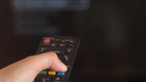 Remote Control used to control the Smart TV Stock Footage 239015470