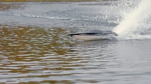 Remote controled speedboat on the river Stock Footage 97862940