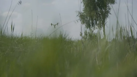 Remote controlled drone flying above field Vídeos de archivo 94604292