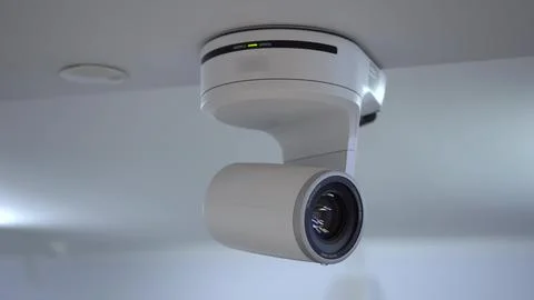 The remote controlled motorized camera is moving. Ceiling-mounted camera for Stock Photos
