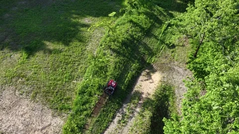 Remote Controlled Mower Operating on Grassy Slope in Japan Stock Footage 336562666