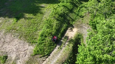 Remote Controlled Mower Working on Slope from Fixed Overhead View Stock Footage 336562648