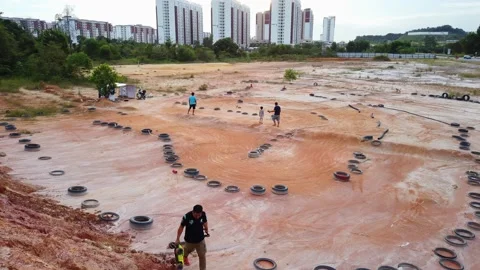 Remote controlled playing car in a Racing track. Kid practicing remote contro Stock Footage 141055596