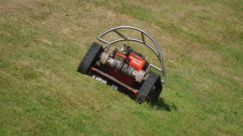 Remote-controlled slope mower Agria 9600 in operation Stock Footage 334985181