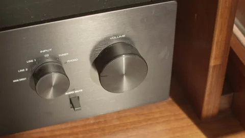 Remote controlled volume knob on a black stereo rotating on its own Stock Footage 170114334