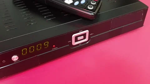 Remote controller and Receiver for Satellite and IP TV STB on red background Stock Footage 170380135
