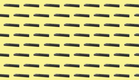 Remote controller pattern on light yellow background. Collage design Stock Photos
