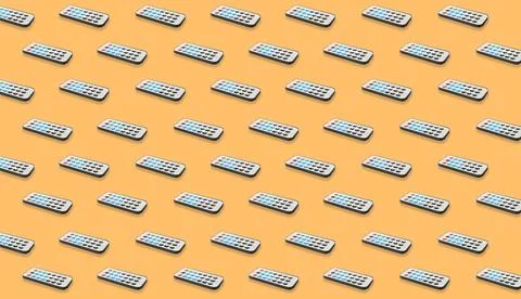 Remote controller pattern on pale orange background. Collage design Stock Photos