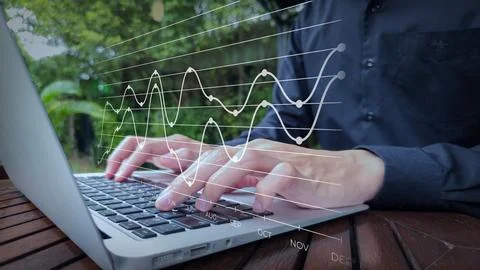 Remote Data Analysis with Monthly Trend Graph Overlay Stock Photos