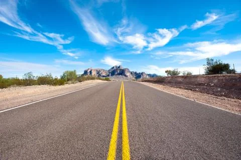 Remote desert road Stock Photos