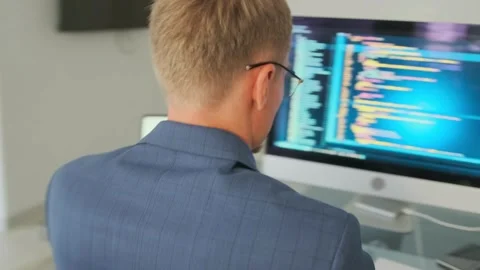 Remote developer tests program interface with tablet in living room. Stock Footage 294299054