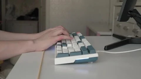 Remote developer typing on mechanical keyboard Stockbeeldmateriaal 336289305
