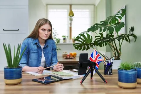Remote distance learning, online lesson of female student using smartphone Stock Photos