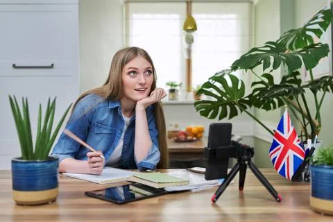 Remote distance learning, online lesson of female student using smartphone Stock Photos