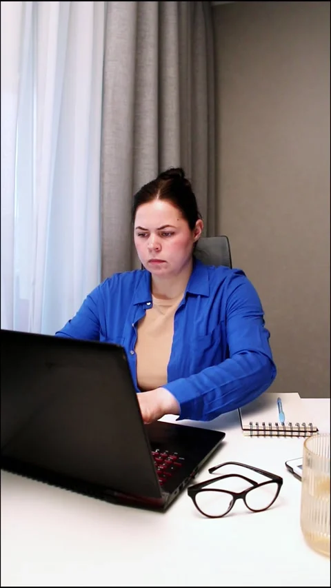 Remote employee analyzing reports during productive workday at home office Stock Footage 327457792