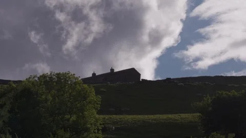 Remote farm house on hillside at dusk, Britain, UK Stock Footage 342276761