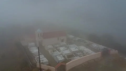 Remote forest graveyard and church hidden in dark misty atmosphere Stock Footage 344096919