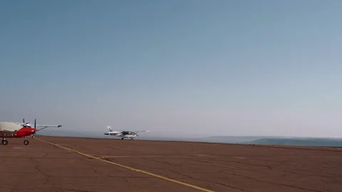 Remote frame on the deserted aerodrome, in which a blue and white helicopter Stock Footage 155935288