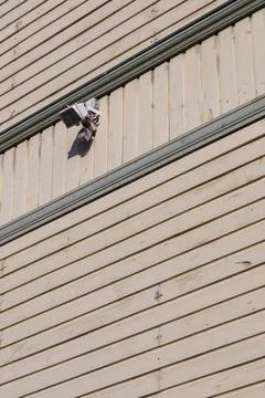 Remote gate control sensor and outdoor light on residential building facade Stock Photos