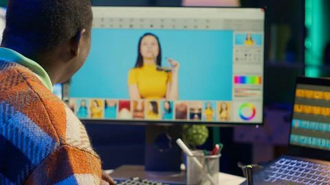 Remote graphic designer using advanced editing software and isolated display Foto stock