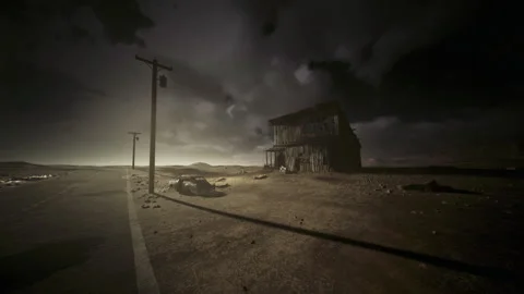 Remote highway lost in stormy darkness with ominous shadowed clouds overhead Stock Footage 343622217