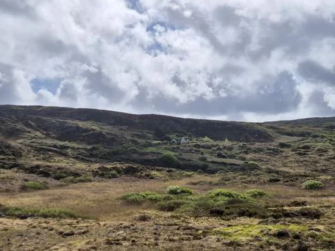 Remote hillside landscape with dramatic cloudy sky 写真素材