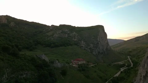 Remote historic building standing in a green mountain valley Stock-Footage 345165996