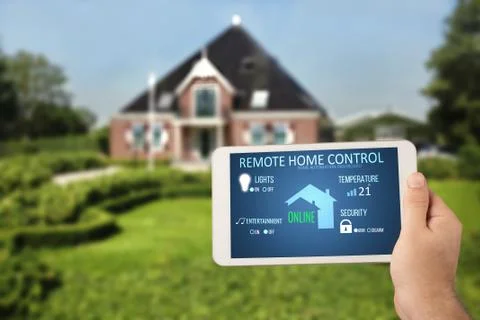 Remote home control system on a digital tablet Stock Photos