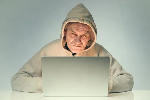 Remote intrusion of computer hacker to bank account of victim Stock Photos