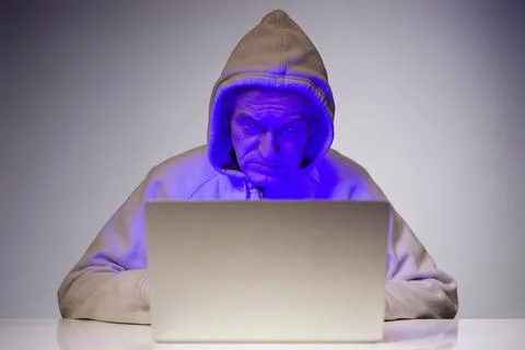 Remote intrusion of computer hacker to bank account of victim Stock Photos