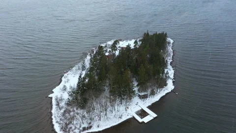 Remote island covered in snow at winter. Flying over the Swedish east coast Stock Footage 149529982