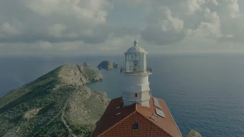 Remote island lighthouse close drone flyby Stock Footage 238366042
