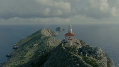 Remote island lighthouse close drone flyby Stock Footage 238366195